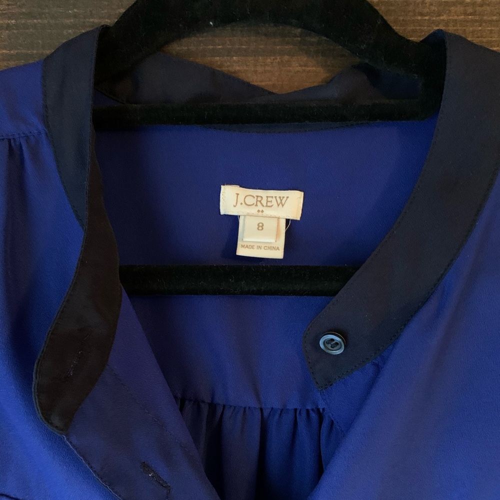 Blue and navy sleeveless button up